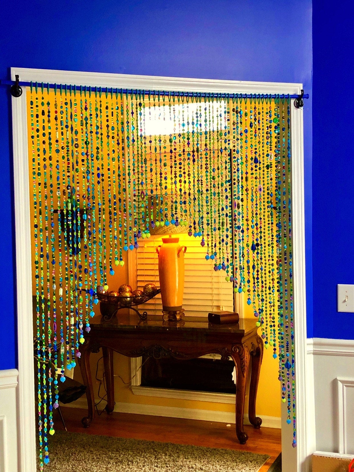 Arch-Shaped Beaded curtain for a door in shadows of green blue and purple