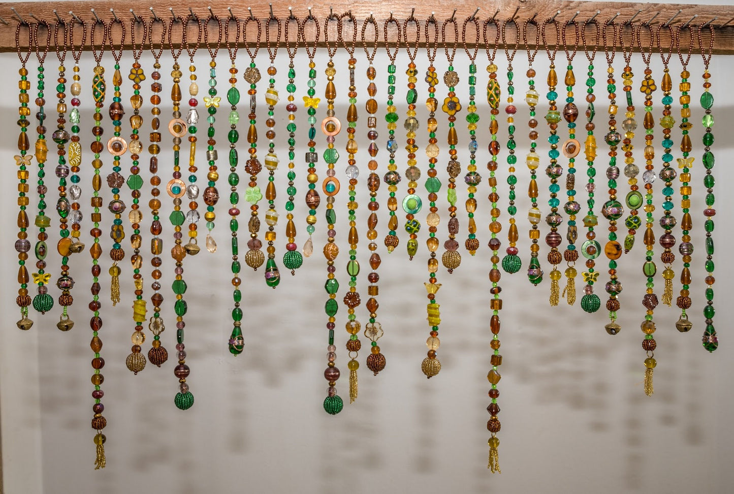 Beaded Valance in shadows of Green, Yellow, Brown, and touches of gold