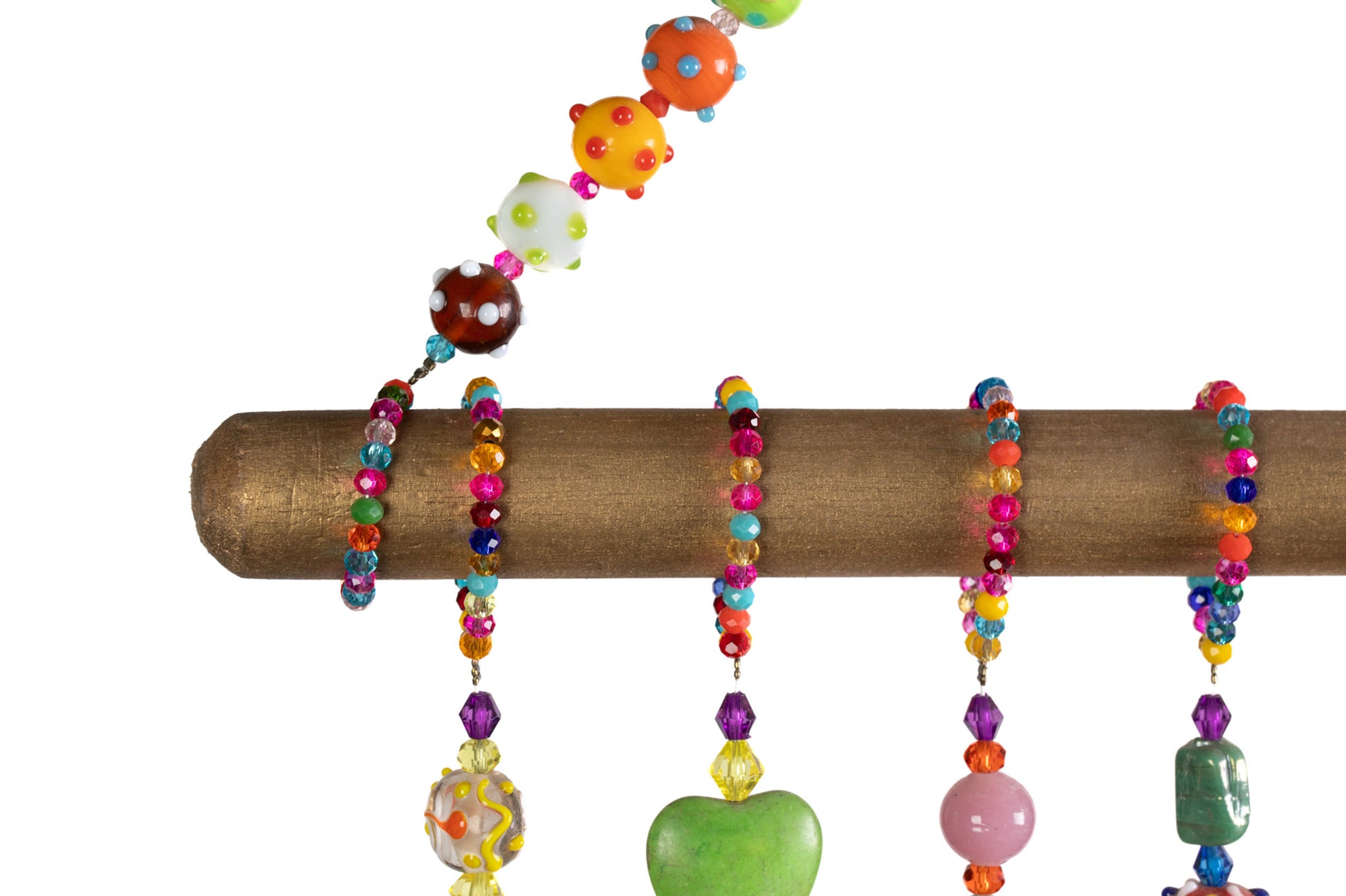 Beaded loops hanging from colorful glass bead strands on handmade wall mobile