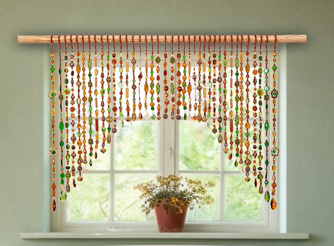 Decorative beaded curtain hanging in front of a window with a plant on the sill.