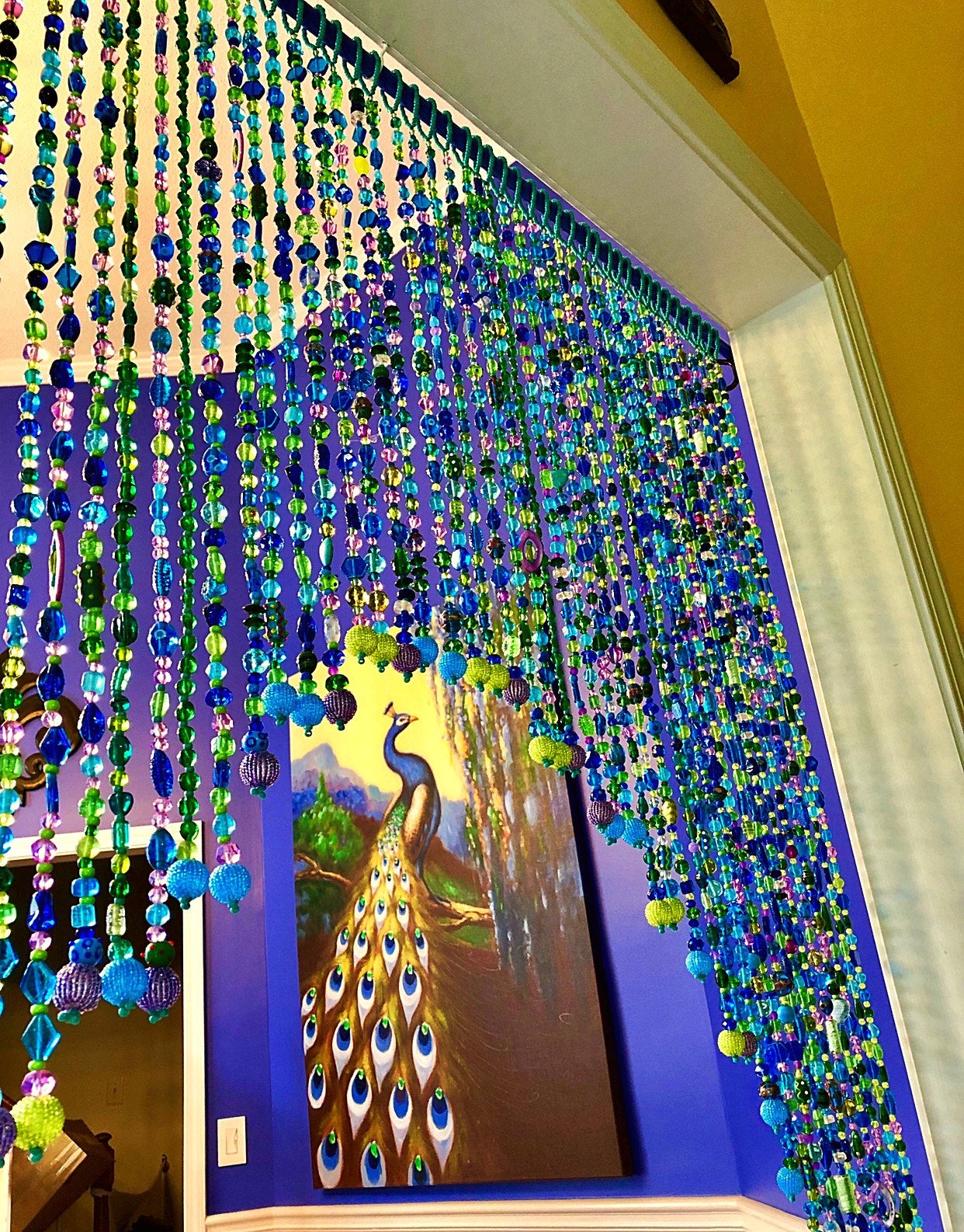 Arch-Shaped Beaded curtain for a door in shadows of green blue and purple