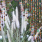 Door Beaded curtain Arch Shape in Brown, Amber, Orange, Green and Gold Tones.