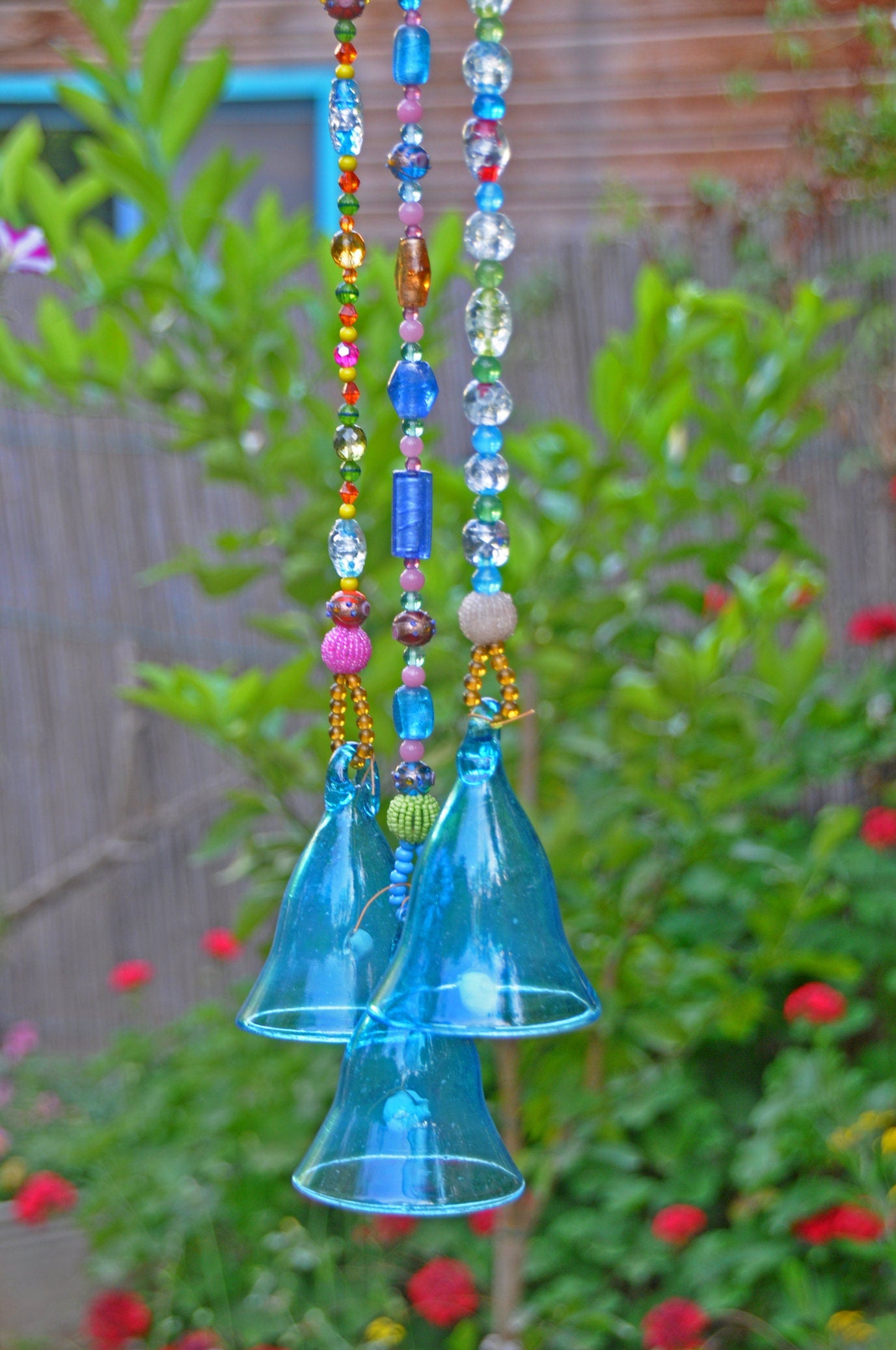 Three Turquoise glass Blown bells on a Beaded strings