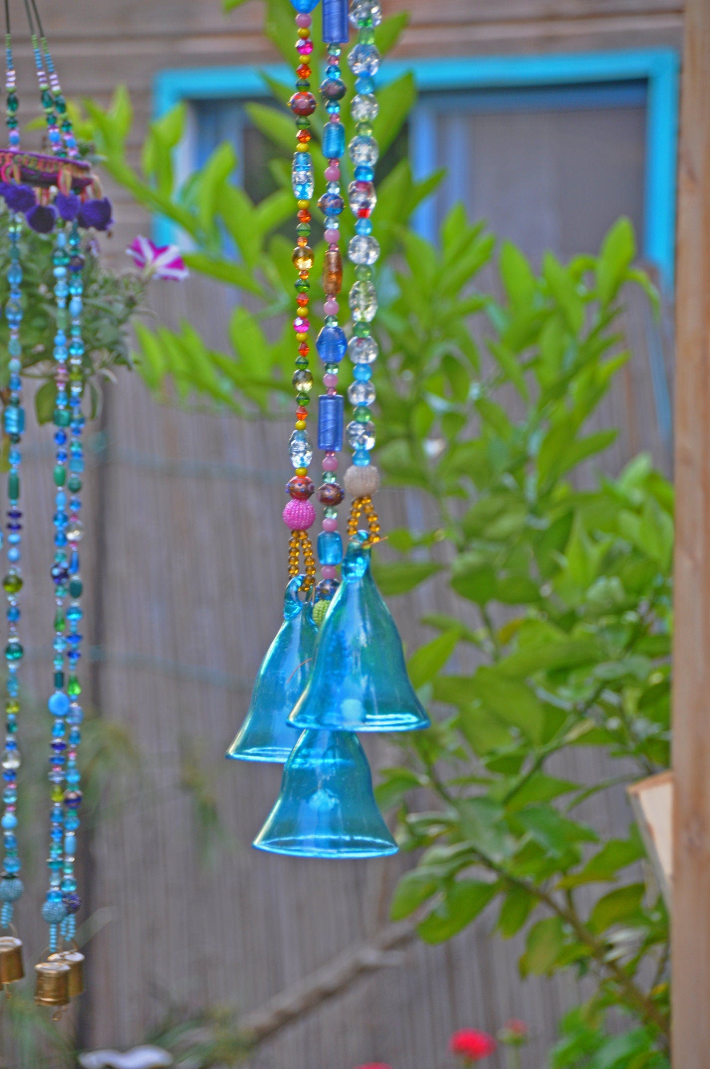 Three Turquoise glass Blown bells on a Beaded strings